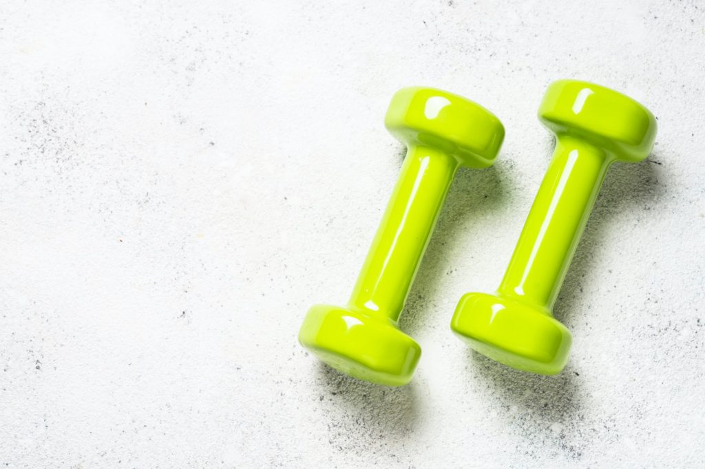 Dumbbells on white background top view